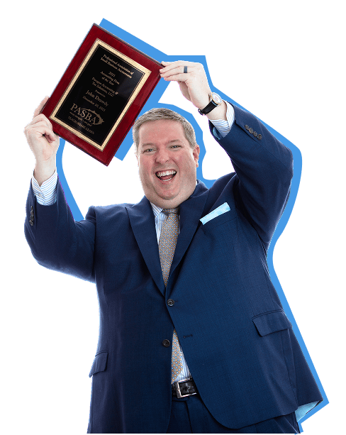 John Drawdy, owner of Paragon Accounting, holding the PASBA award won in 2021